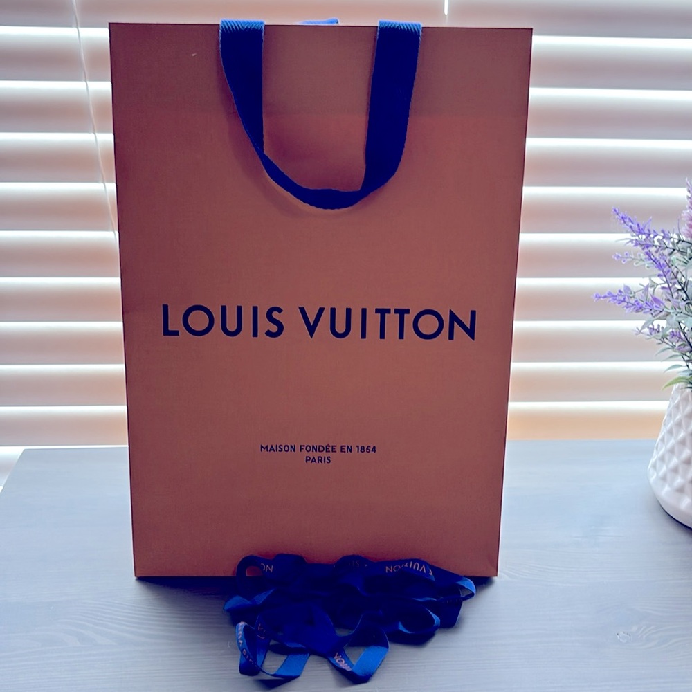 LV bag and ribbon.
